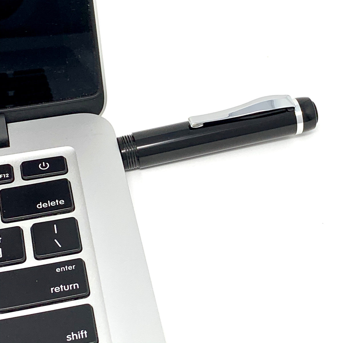 Recording pen VP-99 USB end plugged into a laptop