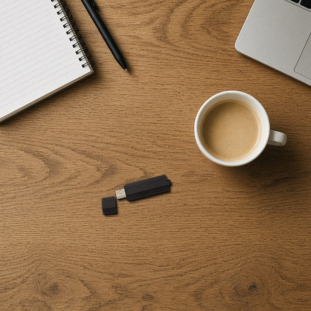 VR-16 voice activated recorder on a desk next to a coffee mug and pen